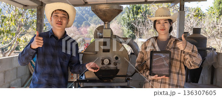 Coffee processing. Coffee roasting machine with arabica beans in stainless steel cooling bin. 136307605