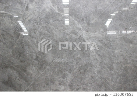 Polished Tundra Grey marble texture with neutral grey surface and thin white veins spreading evenly. 136307653