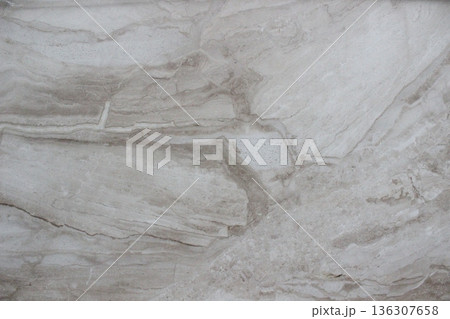 Grey Travertine marble texture with natural streaks forming cloud patterns and beautiful sedimentary rock grains. 136307658
