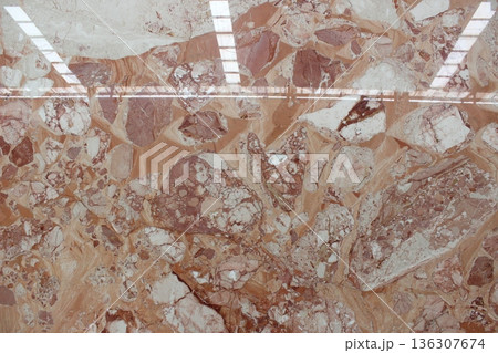 Breccia Oniciata pink marble texture with beige and white fragments. This Italian marble features a warm breccia pattern for classic interior design. 136307674