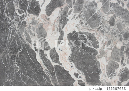 Breccia Grigio marble texture featuring grey rock fragments and thick, dynamic creamy white veins. Breccia Grigio marble texture featuring grey rock fragments and thick, dynamic creamy white veins. 136307688