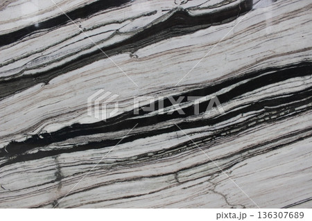 Panda White marble texture with bold black stripes contrasting on a white base for contemporary design. 136307689