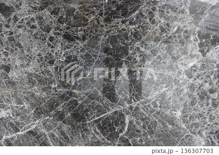Polished Armani Grey marble texture with random white crackle patterns providing a luxurious feel to any space. 136307703