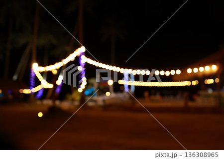 vintage tone blur image of food stall at night festival with bokeh	 136308965