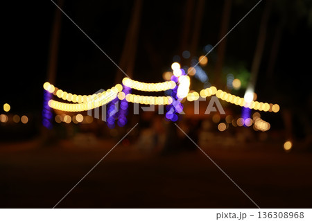 vintage tone blur image of food stall at night festival with bokeh	 136308968