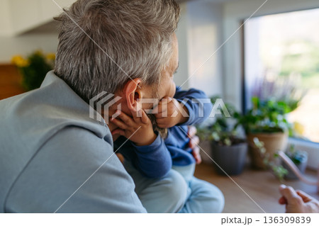 Little toddler giving kiss to father. 136309839