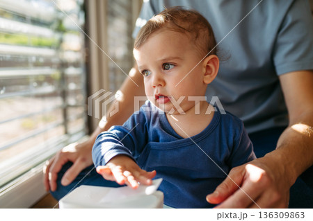 Father with little toddler son at home. Father with little toddler son at home. 136309863