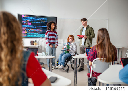 Inclusive student team presenting technology project in class. Inclusive student team presenting technology project in class. 136309935