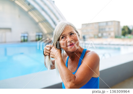 Senior woman preparing for swim t. raining to stay healthy and active 136309964