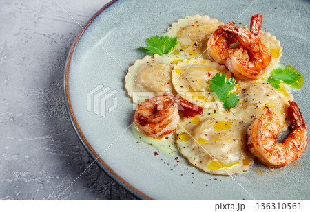 ravioli with shrimp, in cream sauce, with spices and herbs, top view, no people, 136310561