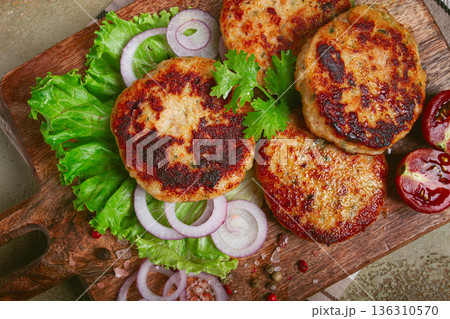 fried chicken cutlets, minced chicken, with vegetables, on a cutting board, with vegetable salad, top view, homemade, no people, 136310570