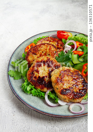 fried chicken cutlets, minced chicken, with vegetables, on gray , with vegetable salad, top view, homemade, no people, 136310571