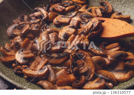 fried mushrooms in a frying pan, with a wooden fork, homemade, no people, 136310577