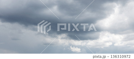 Blue gray stormy sky full of clouds, natural photo 136310972