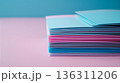 Colorful paper stack with blurred pastel backdrop for office and corporate projects 136311206