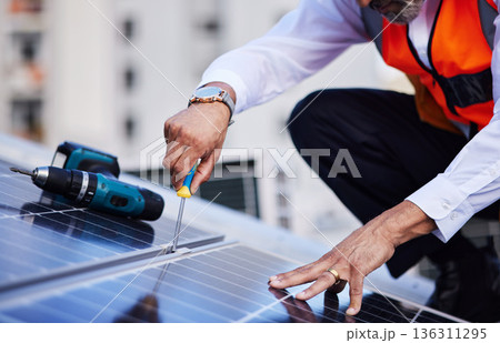 Solar panels, man hands and tools for engineering maintenance, sustainability development and rooftop, Grid, screwdriver and industrial worker or electrician for eco photovoltaic installation in city Solar panels, man hands and tools for engineering maintenance, sustainability development and rooftop, Grid, screwdriver and industrial worker or electrician for eco photovoltaic installation in city 136311295