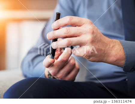 Man, hands and test blood sugar for diabetes, health analysis or medical glucometer results in office. Closeup of worker poke finger with needle to check insulin, monitor glucose or diabetic medicine 136311474