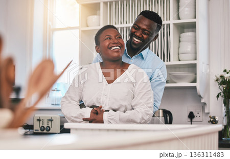 Hug, kitchen and happy black couple laugh, bond or enjoy quality time together, funny conversation or chat in Nigeria home. Love, marriage and African people humour, embrace and smile at comedy joke Hug, kitchen and happy black couple laugh, bond or enjoy quality time together, funny conversation or chat in Nigeria home. Love, marriage and African people humour, embrace and smile at comedy joke 136311483