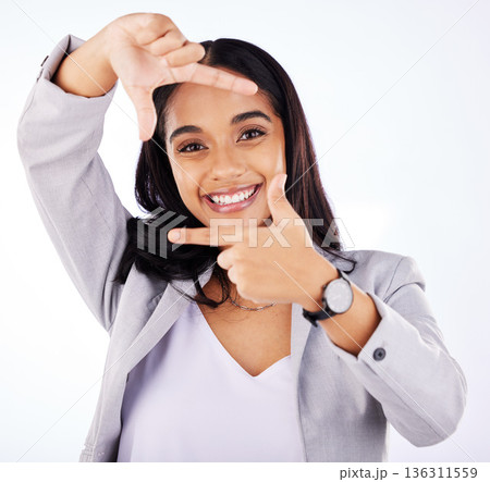 Finger framing, portrait and business woman in studio, white background or creative profile picture. Face of female worker, hands or frame perspective for selfie, photography ideas or planning border 136311559