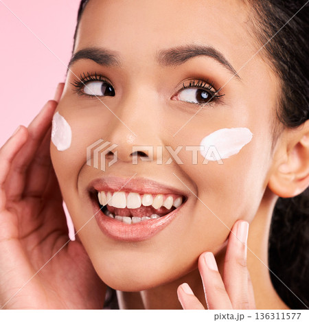 Cream, beauty and face of a happy woman with skin care, dermatology and natural glow. Headshot of a young female aesthetic model with a smile for moisturizer, cosmetics or sunscreen in studio 136311577
