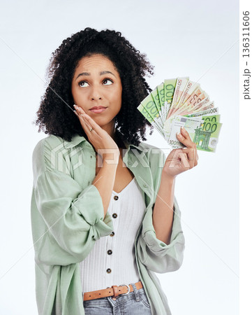 Woman, money fan and thinking in studio for prize, profit or bonus from investing, savings or notes by white background. Isolated African girl, student and decision for cash, win or gambling in lotto Woman, money fan and thinking in studio for prize, profit or bonus from investing, savings or notes by white background. Isolated African girl, student and decision for cash, win or gambling in lotto 136311606