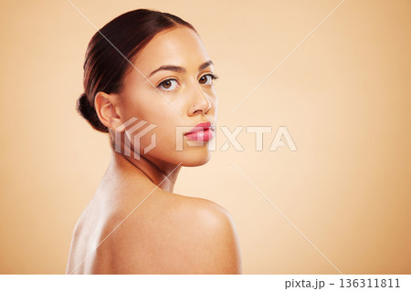 Portrait, beauty and woman with skincare, cosmetics and dermatology against a brown studio background. Face, female person or model with natural makeup and healthy skin with shine, glow and aesthetic Portrait, beauty and woman with skincare, cosmetics and dermatology against a brown studio background. Face, female person or model with natural makeup and healthy skin with shine, glow and aesthetic 136311811