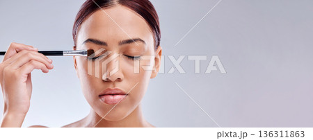 Woman, eye makeup and brush, beauty banner and face with skincare isolated on white background. Mockup space, cosmetology and person apply foundation, cosmetics and tools with eyeshadow in studio Woman, eye makeup and brush, beauty banner and face with skincare isolated on white background. Mockup space, cosmetology and person apply foundation, cosmetics and tools with eyeshadow in studio 136311863