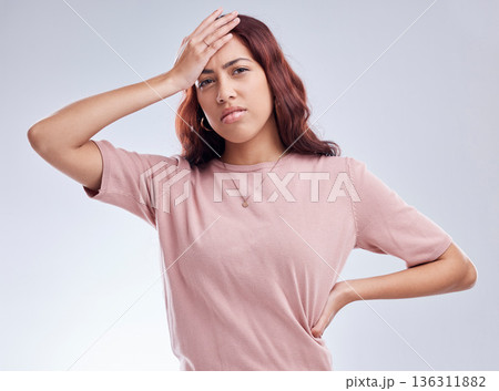 Mistake, regret and young woman in studio with hand on head for anxiety, stress or panic. Portrait of a female model person on a white background with doubt, negative mindset and problem or fail Mistake, regret and young woman in studio with hand on head for anxiety, stress or panic. Portrait of a female model person on a white background with doubt, negative mindset and problem or fail 136311882
