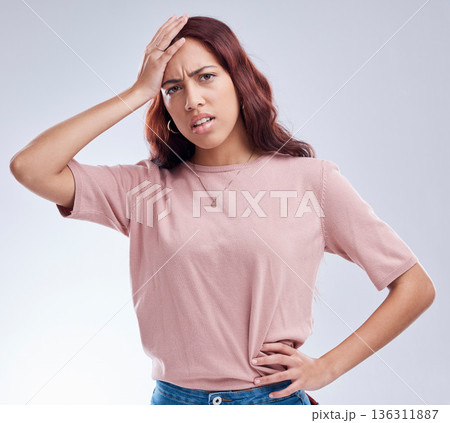 Regret, mistake and young woman in studio with hand on head for anxiety, stress or panic. Portrait of a frustrated female model person on a white background with doubt, stress and problem or fail 136311887