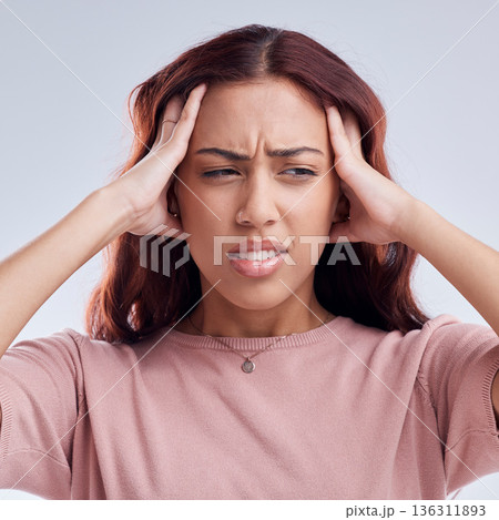 Woman, pain and headache, stress or health problem with brain fog or anxiety isolated on white background. Crisis, disaster and female person with a migraine, sick and dizzy with fatigue in studio 136311893