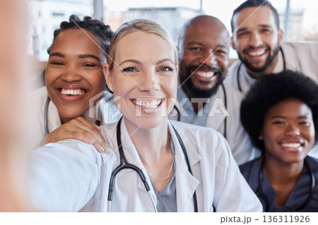 Selfie, portrait and hospital doctors, happy people or surgeon team smile on healthcare, medical photo or health services. Teamwork support, memory picture or group face of diversity medicare nurses 136311926