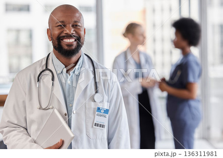 Smile, portrait and hospital doctor, black man or cardiologist team leader of healthcare trust, medical wellness and cardiology. Group leadership, tablet and African person for professional support 136311981