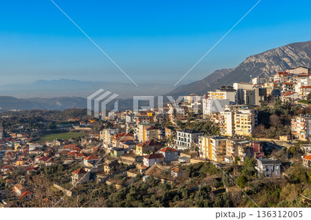Panoramic view of a hillside residential district with traditional and modern buildings with mountain Balkan landscape, Kruja, Albania 136312005