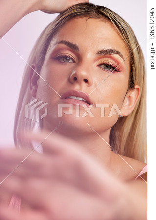 Portrait, beauty or luxury with a model woman in studio on a gray background in ambient lighting for desire. Face, skincare or makeup with a young female person posing for natural feminine confidence 136312045