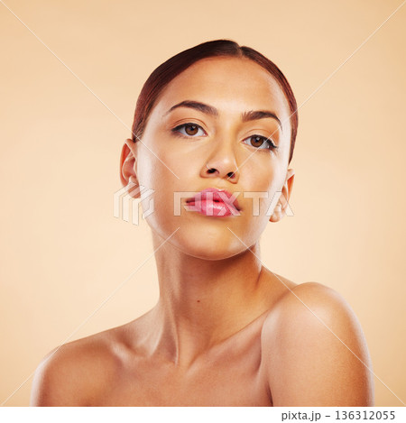 Portrait, dermatology and woman with skincare, cosmetics and luxury against a brown studio background. Face, female person or model with wellness, makeup or healthy skin with shine, glow or aesthetic Portrait, dermatology and woman with skincare, cosmetics and luxury against a brown studio background. Face, female person or model with wellness, makeup or healthy skin with shine, glow or aesthetic 136312055