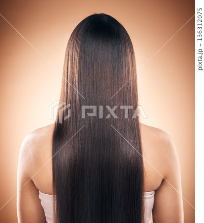 Back, straight hair and beauty of woman in studio isolated on a brown background. Haircare, natural cosmetics and model with salon treatment for balayage hairstyle, growth and aesthetic for wellness Back, straight hair and beauty of woman in studio isolated on a brown background. Haircare, natural cosmetics and model with salon treatment for balayage hairstyle, growth and aesthetic for wellness 136312075