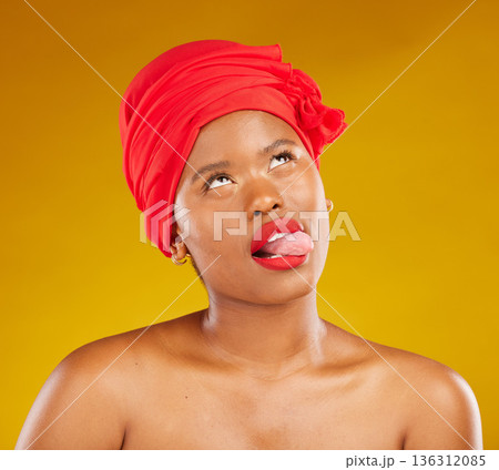 Tongue, fashion and a black woman with makeup on a studio background for beauty and comedy. Idea, playful and a funny face of African girl or model with a headscarf, cosmetics and funny on a backdrop 136312085