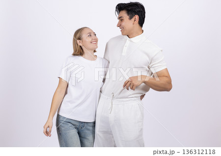 Young man and woman in white t-shirts hugging Young man and woman in white t-shirts hugging 136312118
