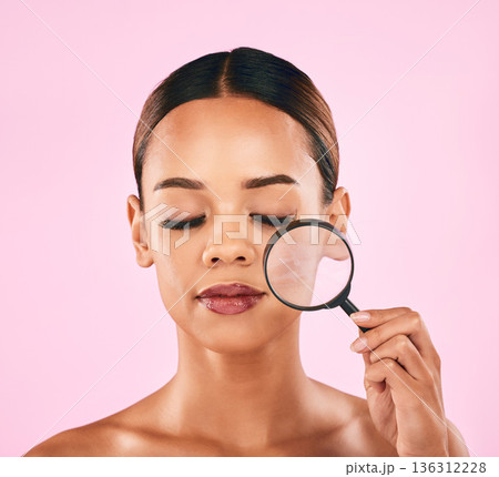 Woman, face and magnifying glass, beauty and zoom in on pores, skincare and makeup isolated on pink background. Search, investigate and check skin with glow, female model and dermatology in studio Woman, face and magnifying glass, beauty and zoom in on pores, skincare and makeup isolated on pink background. Search, investigate and check skin with glow, female model and dermatology in studio 136312228