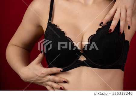 Close up of black lace bra on female model Close up of black lace bra on female model 136312246