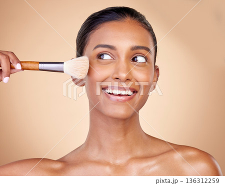 Beauty, makeup and smile with woman and brush in studio for facial, foundation and self care. Cosmetics, product and tools with face of model on brown background for glow, skincare and dermatology Beauty, makeup and smile with woman and brush in studio for facial, foundation and self care. Cosmetics, product and tools with face of model on brown background for glow, skincare and dermatology 136312259