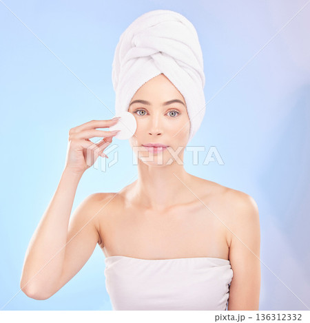 Skincare, face pad and portrait of woman in studio for a natural, self care and spa routine. Beauty, health and young female model from Australia with clean skin treatment isolated by blue background 136312332