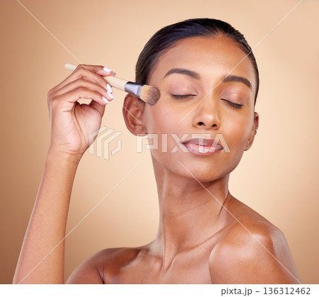 Beauty, makeup and skincare with woman and brush in studio for facial, foundation and self care. Cosmetics, product and tools with face of model on brown background for glow, relax and dermatology Beauty, makeup and skincare with woman and brush in studio for facial, foundation and self care. Cosmetics, product and tools with face of model on brown background for glow, relax and dermatology 136312462