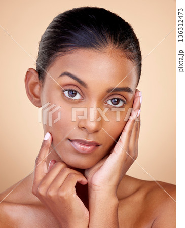 Portrait, beauty or Indian woman with natural facial glow with dermatology skincare cosmetics in studio. Aesthetic face, brown background or gen z girl model with wellness, shine or self love glow Portrait, beauty or Indian woman with natural facial glow with dermatology skincare cosmetics in studio. Aesthetic face, brown background or gen z girl model with wellness, shine or self love glow 136312473