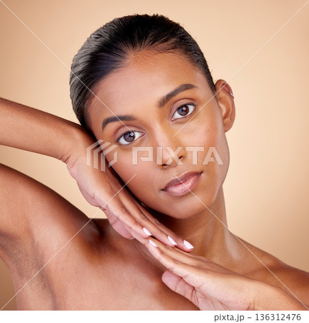 Skincare, beauty and portrait with indian girl for glow or self care in brown studio, background. Dermatology, girl and natural cosmetic with spa treatment for luxury facial in mock up for wellness. Skincare, beauty and portrait with indian girl for glow or self care in brown studio, background. Dermatology, girl and natural cosmetic with spa treatment for luxury facial in mock up for wellness. 136312476