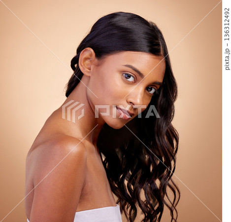 Balayage, hair and woman in portrait, beauty and shine with cosmetic care isolated on studio background. Female model, haircare and growth, cosmetology and texture with growth and curly hairstyle 136312492
