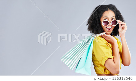 Shopping, bag and woman excited for retail sale, promotion or happy for discount on studio, mockup or grey background. Wow, customer and girl to shop for fashion or sales on luxury clothing Shopping, bag and woman excited for retail sale, promotion or happy for discount on studio, mockup or grey background. Wow, customer and girl to shop for fashion or sales on luxury clothing 136312546