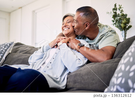 Hug, surprise kiss and happy elderly couple bonding, relax and spending time together, smile and enjoy home retirement. Living room, love or senior man, old woman or sweet people with marriage care Hug, surprise kiss and happy elderly couple bonding, relax and spending time together, smile and enjoy home retirement. Living room, love or senior man, old woman or sweet people with marriage care 136312612