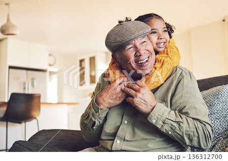 Hug, grandparent playing or happy child in family home on sofa with love or care bonding together. Piggyback, living room couch or senior grandfather with young girl, smile or kid to relax in house 136312700