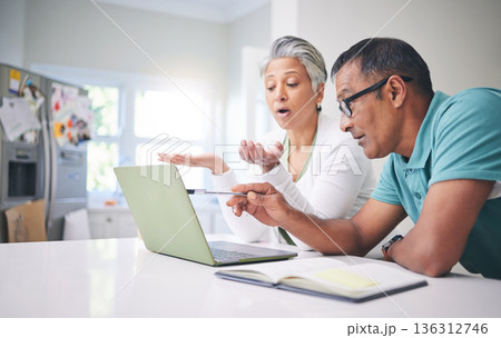 Mature couple, home and planning with laptop, notebook and internet for bills, tax or budget. Man and woman talking about online research, debt solution or insurance website information on technology Mature couple, home and planning with laptop, notebook and internet for bills, tax or budget. Man and woman talking about online research, debt solution or insurance website information on technology 136312746